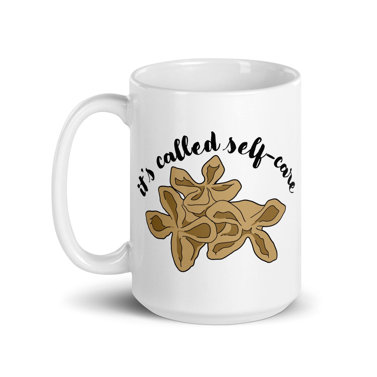 A white, 15 ounce ceramic mug featuring an illustration of three pieces of crab rangoon. Text in an arc above the crab rangoon reads "it's called self-care" in a cursive script.