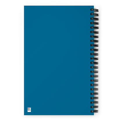 The blank back side of a blue wire-bound notebook