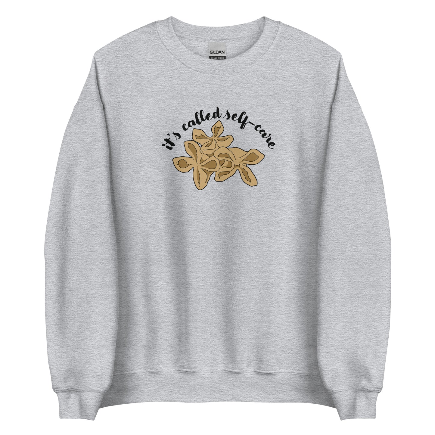 A gray crewneck sweatshirt featuring an illustration of three pieces of crab rangoon. Text in an arc above the crab rangoon reads "it's called self-care" in a cursive script.