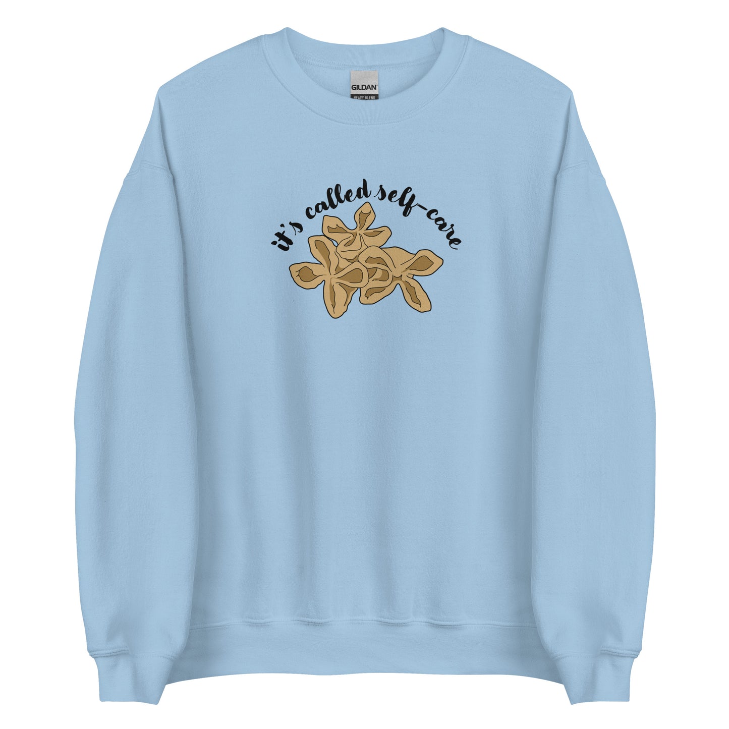 A light blue crewneck sweatshirt featuring an illustration of three pieces of crab rangoon. Text in an arc above the crab rangoon reads "it's called self-care" in a cursive script.