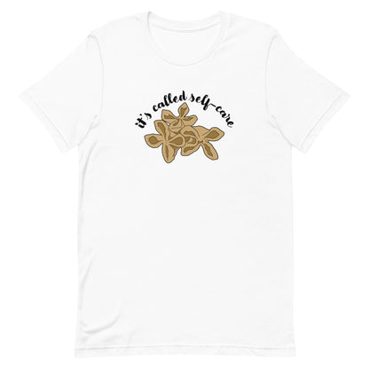 A white crewneck t-shirt featuring an illustration of three pieces of crab rangoon. Text in an arc above the crab rangoon reads "it's called self-care" in a cursive script.