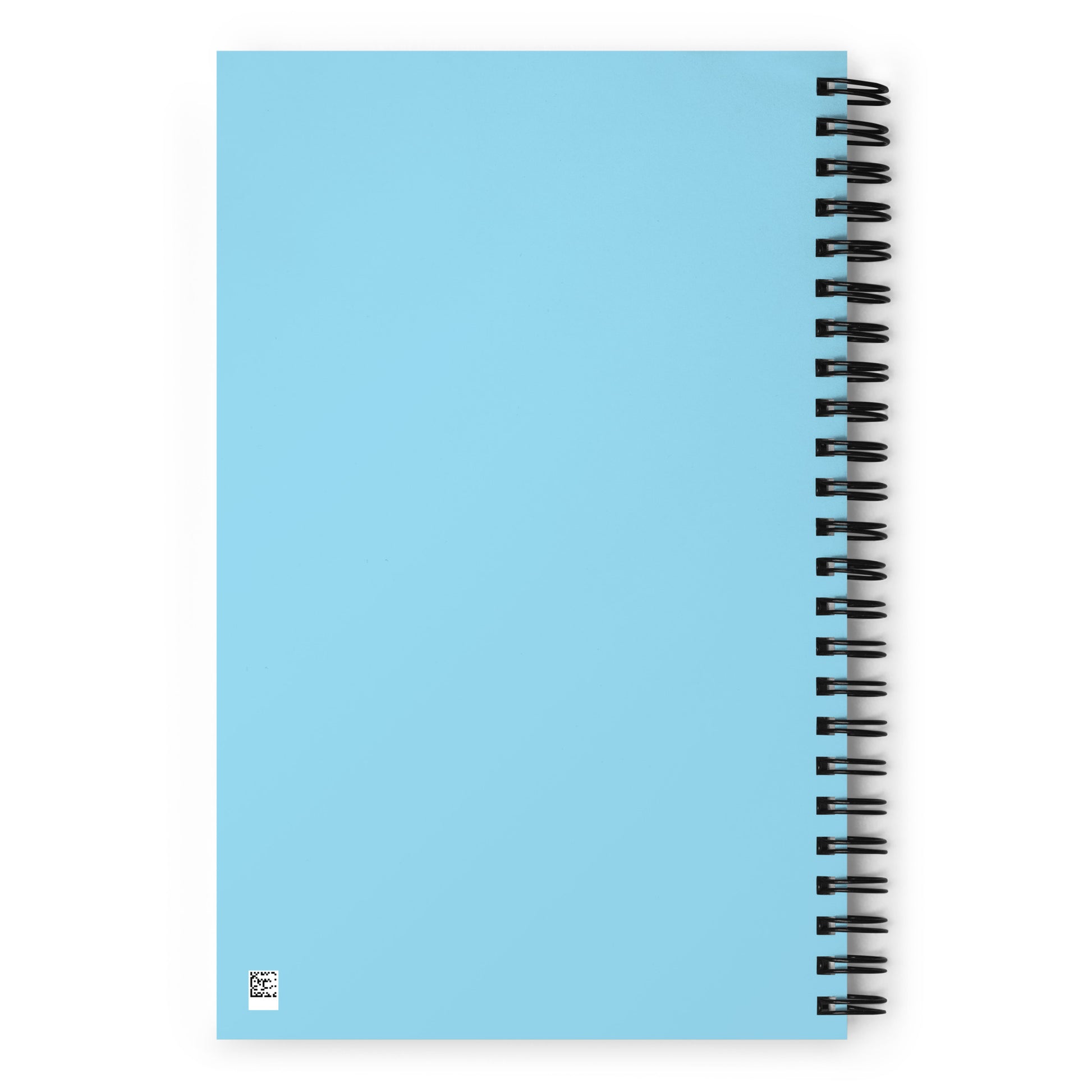 The back side of a light blue o-ring bound notebook.