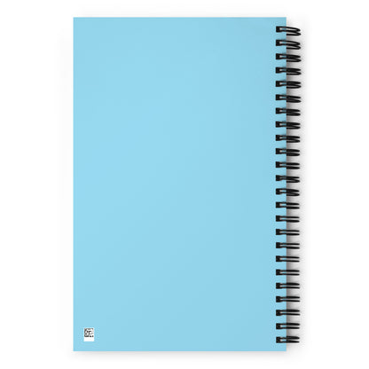 The back side of a light blue o-ring bound notebook.