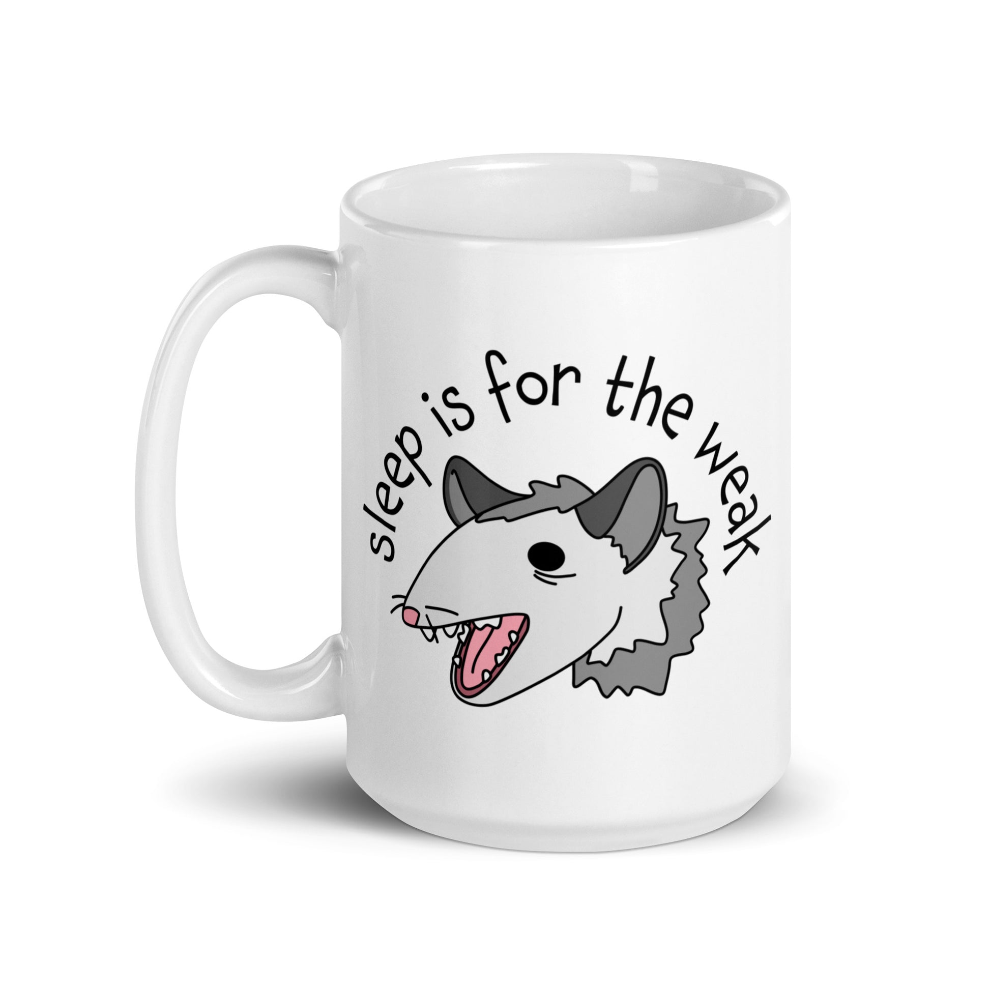 A white 15 ounce ceramic coffee mug featuring an illustration of an opossum with its mouth open, as if it was yelling. Text alongside the opossum reads "sleep is for the weak"