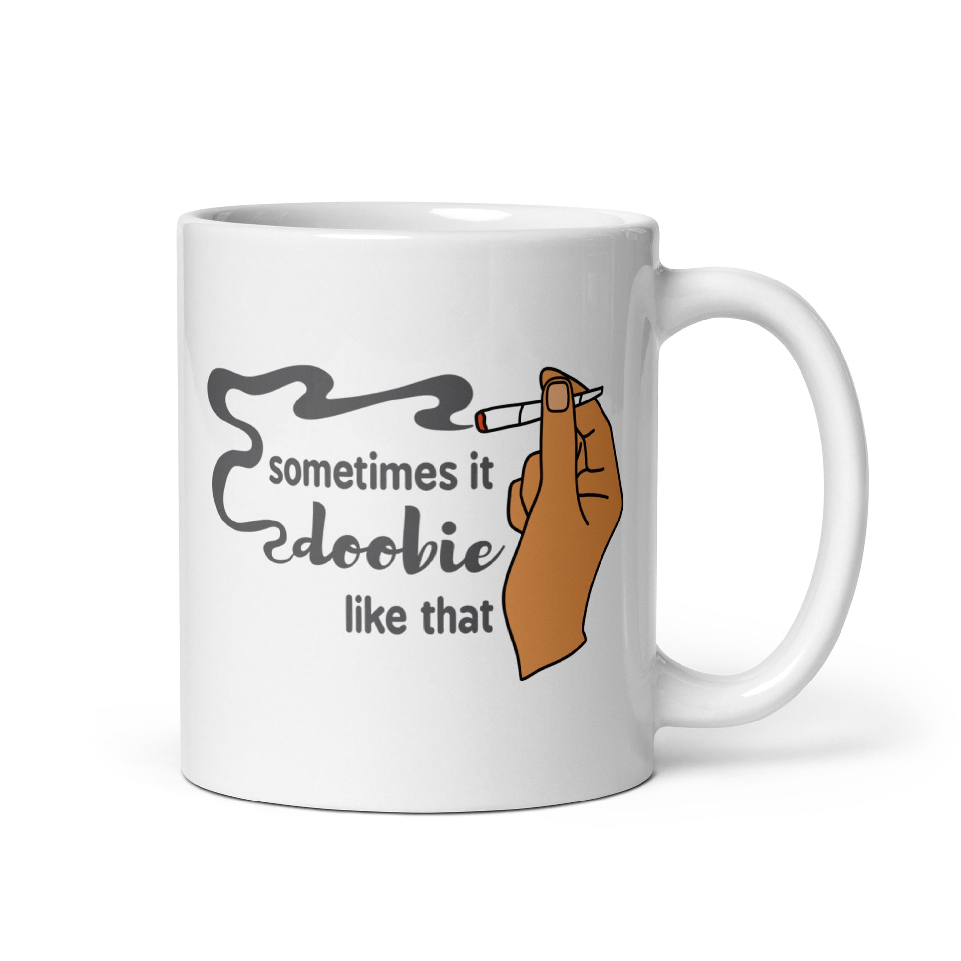 A white 11 ounce ceramic coffee cup featuring an illustration of a hand with medium-toned skin holding a joint. Text alongside the hand reads "sometimes it doobie like that" with the word "doobie" made from smoke from the joint.