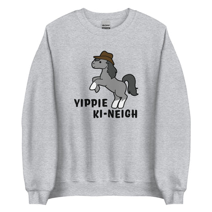 A grey crewneck sweatshirt featuring an illustration of a smiling grey pony rearing and wearing a cowboy hat. Text underneath the pony reads "Yippie Ki-Neigh"