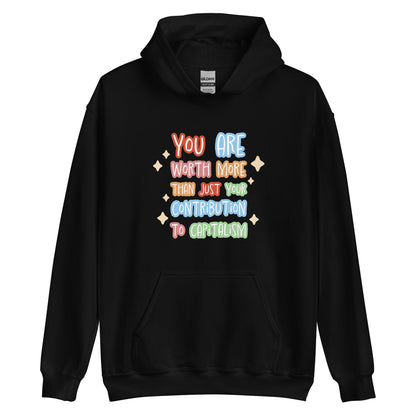 A black hooded sweatshirt featuring colorful hand-written-style text that reads "You are worth more than just your contribution to capitalism". Sparkles surround the text on each side.