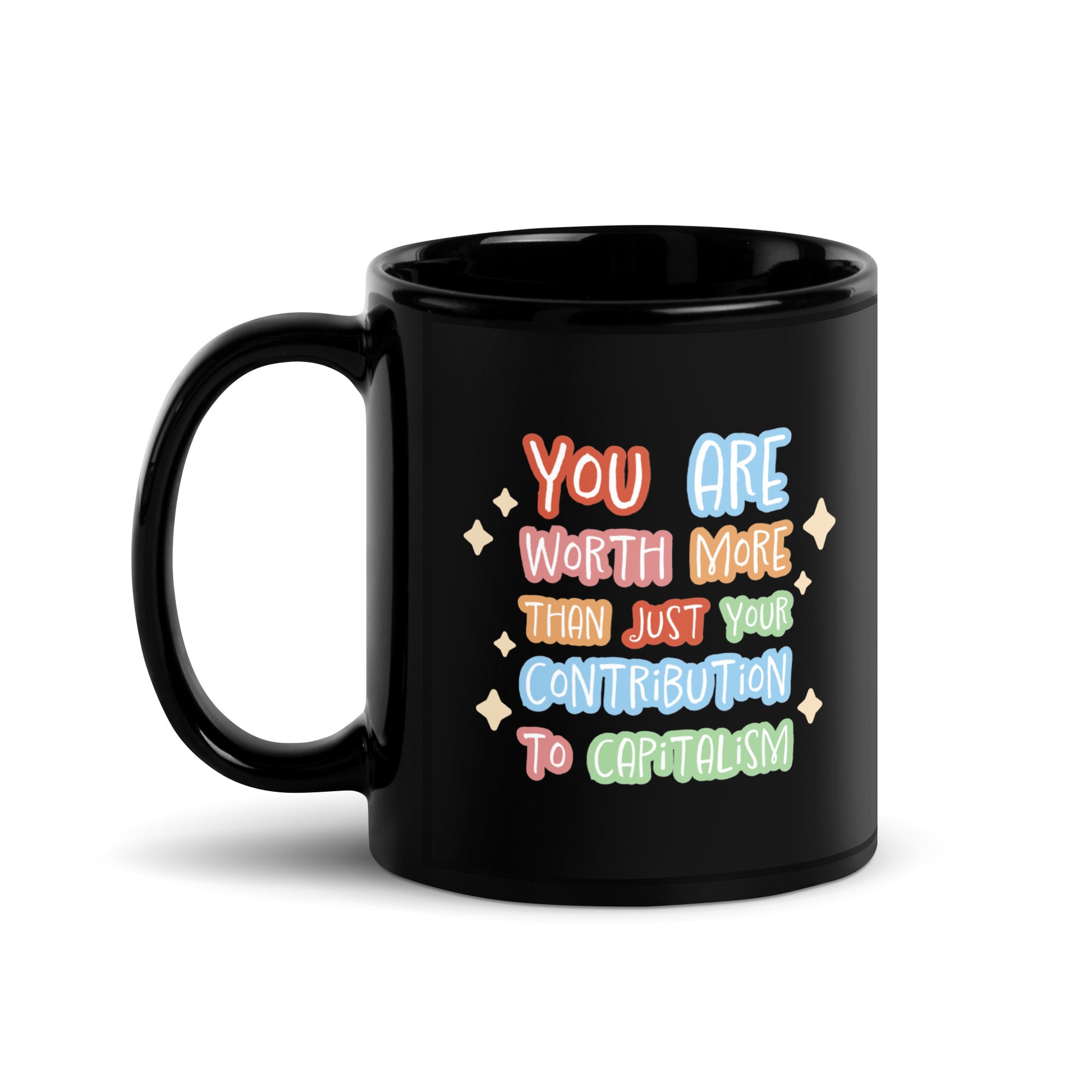A black ceramic 11 ounce mug featuring colorful hand-written-style text that reads "You are worth more than just your contribution to capitalism". Sparkles surround the text on each side.