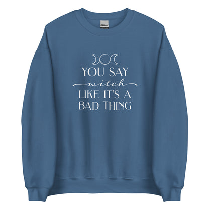 A blue crewneck sweatshirt featuring the triple goddess symbol and text reading "You say witch like it's a bad thing"