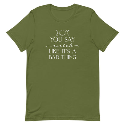 An olive crewneck t-shirt featuring the triple goddess symbol and text reading "You say witch like it's a bad thing"