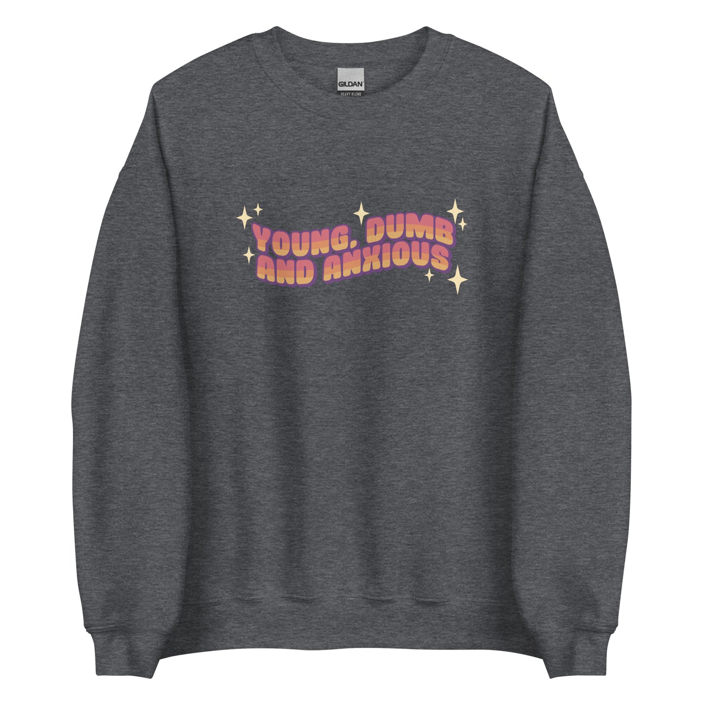 A dark grey crewneck sweatshirt featuring text in a pink-to-yellow gradient, surrounded by sparkles. The text reads "Young, dumb and anxious" in a blocky font.